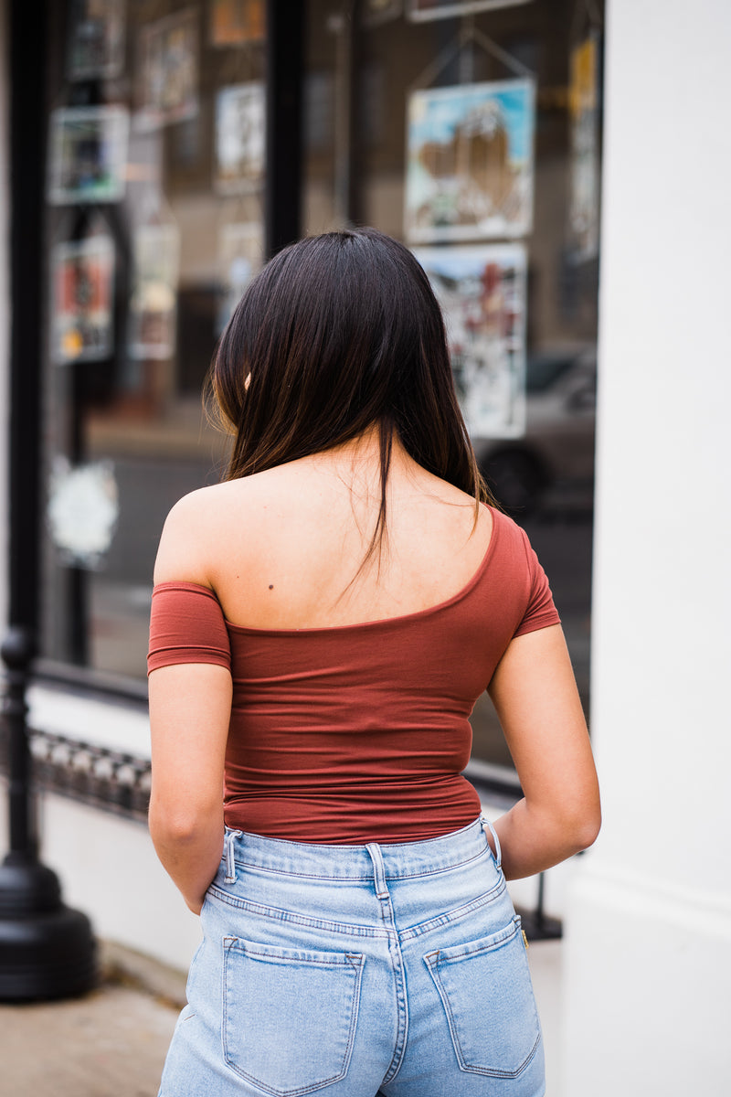 Back view of red brown off the shoulder bodysuit