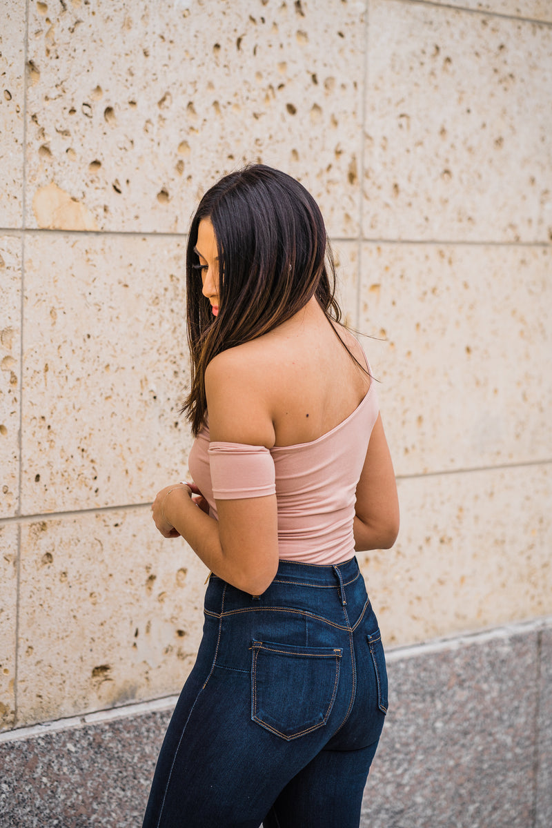 Side view of nude off the shoulder bodysuit
